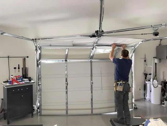 Richmond Hill Garage Door Repair specialist performing precise section replacement on Richmond Hill garage door
